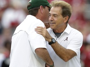 Colorado State coach Mike Bobo, left, and Alabama head coach Nick Saban shake hands before an NCAA college football game, Saturday, Sept. 16, 2017, in Tuscaloosa, Ala. (AP Photo/Brynn Anderson)