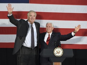 Vice President Mike Pence, right, makes a campaign stop to support Sen. Luther Strange in Birmingham, Ala., Monday, Sept. 25, 2017. President Donald Trump called an Alabama radio show Monday to urge support for Strange in Tuesday's runoff for the GOP nomination, and Pence campaigned for Strange in Birmingham while Trump's former strategist, Steve Bannon, spoke at a Moore rally at the coast. (Joe Songer/AL.com via AP)