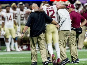 Florida State quarterback Deondre Francois (12) is helped off the field after an injury during the second half against Florida State in an NCAA college football game, Saturday, Sept. 2, 2017, in Atlanta. (Vasha Hunt//AL.com via AP)