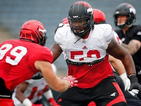 Calgary Stampeders offensive lineman Randy Richards, right, takes part in an Aug. 31, 2017 practice.