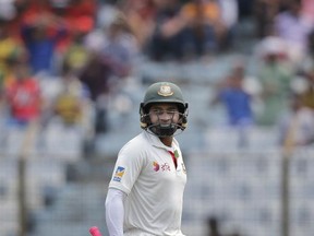 Bangladesh's captain Mushfiqur Rahim walks back to the pavilion after his dismissal by Australia's Nathan Lyon during the second day of their second test cricket match in Chittagong, Bangladesh, Tuesday, Sept. 5, 2017. (AP Photo/A.M. Ahad)