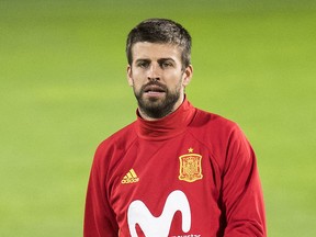 FILE  - In this Monday, Sept 4, 2017 file photo, Spain's Gerard Pique takes part in a training session a day prior to the World Cup Group G qualifying soccer match between Liechtenstein and Spain at the Rheinpark stadium in Vaduz, Liechtenstein. Spain coach Julen Lopetegui has defended Gerard Pique from critics who question his loyalty to the national team because of his support for a disputed referendum on Catalan independence. (Gian Ehrenzeller/Keystone via AP, FIle)