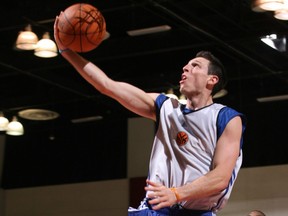 In this July 16, 2010 file photo, then-New York Knicks guard Andy Rautins drives to the basket at NBA Summer League.