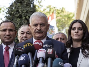 Turkish Prime Minister Binali Yildirim speaks to the media in Ankara, Turkey, Friday Sept. 22, 2017. Yildirim said Friday his country will never accept a separate Kurdish state in neighboring Iraq and would not refrain from taking steps to prevent it. Binali Yildirim again called on Iraqi Kurdish leaders to abandon plans for a referendum on independence, saying it was not too late for them to turn away "from this adventure." (Turkish Prime Ministry, pool photo via AP)
