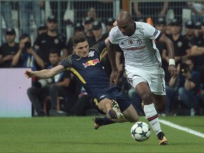 Besiktas' Ryan Babel, right, with RB Leipzig's Marcel Sabitzer during the Champions League group G soccer match between Besiktas and RB Leipzig at the Vodafone Park Stadium in Istanbul, Tuesday, Sept. 26, 2017. (AP Photo)