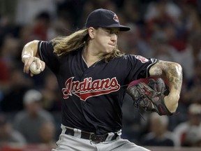 Cleveland Indians starting pitcher Mike Clevinger throws against the Los Angeles Angels during the first inning of a baseball game in Anaheim, Calif., Tuesday, Sept. 19, 2017. (AP Photo/Chris Carlson)