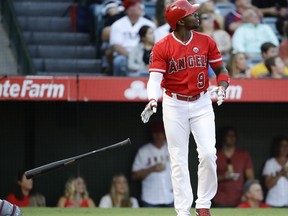 Los Angeles Angels' Justin Upton watches his home run against the Texas Rangers during the first inning of a baseball game in Anaheim, Calif., Saturday, Sept. 16, 2017. (AP Photo/Chris Carlson)