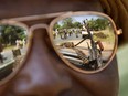 A Chadian soldier wearing reflective sunglasses observes the convoy ahead of him, Jan. 2, 2013