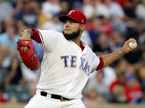 Texas Rangers starting pitcher Martin Perez throws to the New York Yankees during the in the second inning of a baseball game, Friday, Sept. 8, 2017, in Arlington, Texas. (AP Photo/Tony Gutierrez)