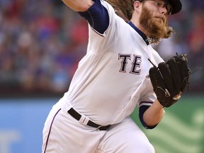 Texas Rangers starting pitcher A.J. Griffin (64) works against the Los Angeles Angels in the second inning of a baseball game, Saturday, Sept. 2, 2017, in Arlington, Texas. (AP Photo/Jeffrey McWhorter)