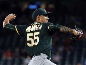 Oakland Athletics starting pitcher Sean Manaea (55) throws to the Texas Rangers in the first inning of a baseball game, Thursday, Sept. 28, 2017, in Arlington, Texas. (AP Photo/Tony Gutierrez)