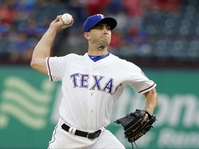Texas Rangers starting pitcher Miguel Gonzalez throws to a Seattle Mariners batter during the first inning of a baseball game, Tuesday, Sept. 12, 2017, in Arlington, Texas. (AP Photo/Tony Gutierrez)