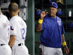 Texas Rangers' Adrian Beltre, right, talks with Rougned Odor (12) in the dugout during the fifth inning of a baseball game against the Los Angeles Angels, Friday, Sept. 1, 2017, in Arlington, Texas. Beltre did not play due to a leg injury. (AP Photo/Tony Gutierrez)
