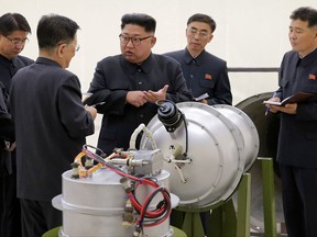 This undated file image distributed on Sunday, Sept. 3, 2017, by the North Korean government, shows North Korean leader Kim Jong Un at an undisclosed location. North Korea's latest nuclear test was part theater, part propaganda and maybe even part fake. But experts say it was also a major display of something very real: Pyongyang's mastery of much of the know-how it needs to reach its decades-old goal of becoming a full-fledged nuclear state.  The jury is still out on whether North Korea tested, as it claims, a hydrogen bomb ready to be mounted on an ICBM.  (Korean Central News Agency/Korea News Service via AP, File)