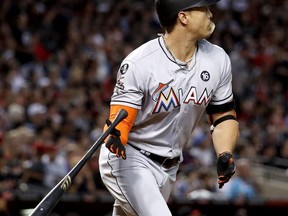 Miami Marlins' Giancarlo Stanton watches his solo home run against the Arizona Diamondbacks during the fourth inning of a baseball game, Saturday, Sept. 23, 2017, in Phoenix. (AP Photo/Matt York)