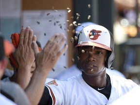 Baltimore Orioles' Tim Beckham celebrates his home run in the dugout during the first inning of a baseball game against the New York Yankees, Monday, Sept. 4, 2017, in Baltimore. (AP Photo/Nick Wass)