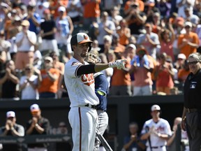 Baltimore Orioles' J.J. Hardy acknowledges the crowd when he came up to bat during the first inning of a baseball game against the Tampa Bay Rays, Sunday, Sept. 24, 2017, in Baltimore. (AP Photo/Nick Wass)