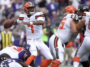 Cleveland Browns quarterback DeShone Kizer (7) passes the ball under pressure during the first half of an NFL football game against the Baltimore Ravens in Baltimore, Sunday, Sept. 17, 2017. (AP Photo/Nick Wass)