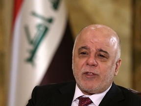 Iraq's Prime Minister Haider al-Abadi speaks during an interview with The Associated Press in Baghdad, Iraq, Saturday, Sept. 16, 2017. Al-Abadi says he is prepared to intervene militarily if the Kurdish region's planned referendum results in violence. (AP Photo/Karim Kadim)