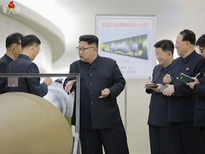 State media said leader Kim Jong Un inspected the loading of a hydrogen bomb into a new intercontinental ballistic missile