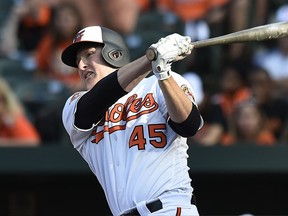 Mark Trumbo singles in the winning run against the Toronto Blue Jays on Sept. 3.