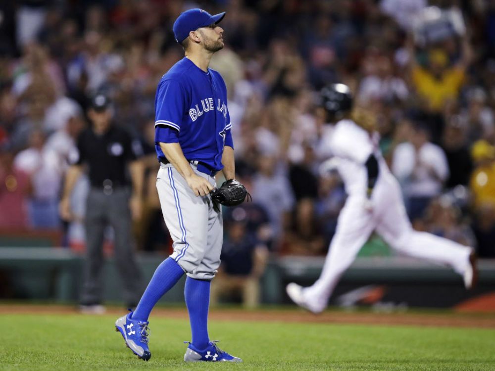 The Toronto Blue Jays centerfielder, Vernon Wells (10) is all smiles as he  rounds the bases after his two run home run blast during the first inning  of Monday's Opening Day baseball