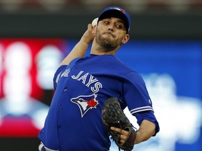 Toronto Blue Jays pitcher Marco Estrada throws against the Minnesota Twins in the first inning of theirlgame Saturday night in Minneapolis.