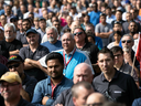 Workers at a Bombardier plant in Toronto assemble to hear Unifor National President Jerry Dias speak.