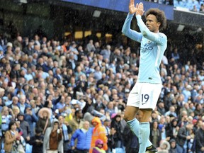 Manchester City's Leroy Sane celebrates after scoring his side's 5th goal during the English Premier League soccer match between Manchester City and Liverpool at the Etihad Stadium in Manchester, England, Saturday, Sept. 9, 2017. Manchester defeated Liverpool by 5-0. (AP Photo/Rui Vieira)