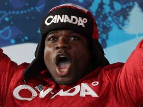 In this Feb. 27, 2010, Lascelles Brown celebrates Canada's bronze-medal finish in four-man bobsleigh at the Vancouver Olympics.