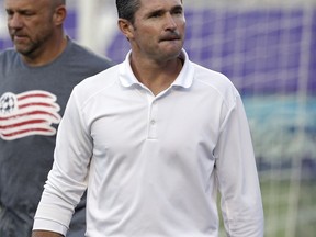 FILE - In this July 31, 2016, file photo, New England Revolution head coach Jay Heaps takes the field before an MLS soccer game against Orlando City in Orlando, Fla. The Revolution announced Tuesday, Sept. 19, 2017, that Heaps had been fired and that assistant coach Tom Soehn will take over as interim head coach for the remainder of the 2017 MLS season. (AP Photo/John Raoux, File)