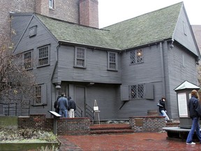 FILE - In this Nov. 24, 2004 file photo, tourists visit the Paul Revere House in the North End neighborhood of Boston. In 2017, archaeologists said they think they found where an outhouse was located next door to Revere's house in the yard of the Pierce-Hichborn House. Experts say the house, built next to Revere's house in 1711, was owned by one of Revere's cousins, and the renowned American patriot himself likely visited on numerous occasions. (AP Photo/Chitose Suzuki, File)