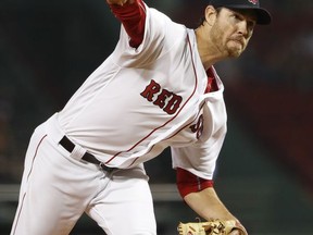 Boston Red Sox starting pitcher Doug Fister delivers to the Toronto Blue Jays during the first inning of a baseball game at Fenway Park in Boston, Wednesday, Sept. 6, 2017. (AP Photo/Winslow Townson)