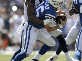 Indianapolis Colts quarterback Scott Tolzien, right, is sacked by Los Angeles Rams linebacker Robert Quinn during the first half of an NFL football game Sunday, Sept. 10, 2017, in Los Angeles. (AP Photo/Jae C. Hong)