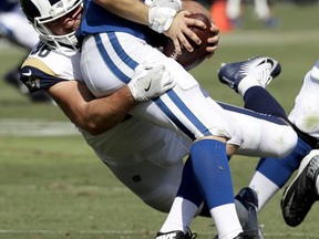 Indianapolis Colts quarterback Scott Tolzien (16) is sacked by Los Angeles Rams linebacker Matt Longacre during the second half of an NFL football game Sunday, Sept. 10, 2017, in Los Angeles. (AP Photo/Alex Gallardo)