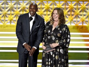 Dave Chappelle, left, and Melissa McCarthy present the award for outstanding directing for a comedy series at the 69th Primetime Emmy Awards on Sunday, Sept. 17, 2017, at the Microsoft Theater in Los Angeles. (Photo by Chris Pizzello/Invision/AP)