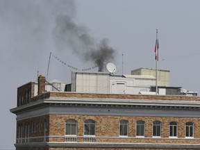 Black smoke rises from the roof of the Consulate-General of Russia Friday, Sept. 1, 2017, in San Francisco. The U.S. on Thursday ordered Russia to shut its San Francisco consulate and close offices in Washington and New York within 48 hours in response to Russia's decision last month to cut U.S. diplomatic staff in Russia. Firemen were called to the consul, but were turned away after being told there was no problem. (AP Photo/Eric Risberg)