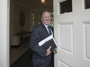 FILE - In this Aug. 11, 2017 file photo, former White House press secretary Sean Spicer stands in the doorway to the Palm Room at the White House in Washington, during renovations to the West Wing. It was a different Spicer who paid a visit to ABC's "Jimmy Kimmel Live" Wednesday night, Sept. 13, 2017. Spicer took Kimmel's ribbing in much better spirits than the grilling the White House press corps dished out. (AP Photo/J. Scott Applewhite, File)