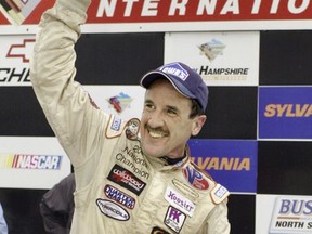 FILE - In this Sept. 16, 2005 file photo, Ted Christopher celebrates his victory in the Busch North Series Sylvania 125 at the New Hampshire International Speedway in Loudon, N.H. NASCAR officials say modified championship racer Christopher was one of two people killed when a small plane crashed in Connecticut. The Federal Aviation Administration confirms that two people were aboard a Mooney M20C plane that went down in a wooded area near the North Branford-Guilford border shortly before 2 p.m. Saturday, Sept. 16, 2017. NASCAR says Christopher and the plane's pilot died. (AP Photo/Jon-Pierre Lasseigne, File)