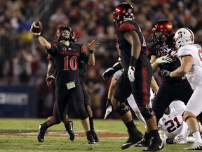 San Diego State quarterback Christian Chapman throws a pass during the first half of an NCAA college football game against Stanford Saturday, Sept. 16, 2017, in San Diego. (AP Photo/Gregory Bull)