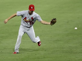 St. Louis Cardinals right fielder Stephen Piscotty can't reach a ball hit for a single by San Diego Padres' Dinelson Lamet during the third inning of a baseball game Wednesday, Sept. 6, 2017, in San Diego. (AP Photo/Gregory Bull)