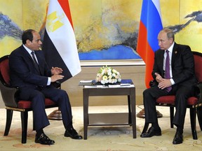 Russian President Vladimir Putin, right, and Egyptian President Abdel-Fattah el-Sissi hold a  bilateral meeting on the sidelines of the BRICS Summit in Xiamen, Fujian province, China, Monday, Sept. 4, 2017. Russian media said Monday that Egypt has finalized a deal to build a nuclear power plant with funding from Moscow after nearly two years of negotiations. (MENA via AP)