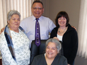 Caldwell First Nation Chief Louise Hillier, front, and band council members smile after receiving a $105 million land settlement offer from the federal government in 2010.