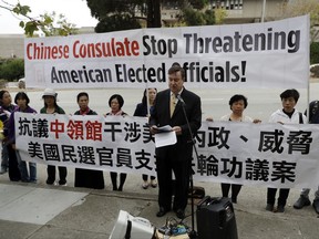 State Sen. Joel Anderson, R-Alpine, center, speaks during a protest organized by Falun Gong practitioners outside the Chinese consulate Friday, Sept. 8, 2017, in San Francisco. Anderson says his attempt to stand up for practitioners of the banned Chinese spiritual movement is being squashed under pressure from the government of China. The Senate last week shelved a symbolic resolution condemning persecution of Falun Gong practitioners after lawmakers received a letter from the Chinese consulate. The letter says the resolution may offend the people of China and damage the relationship between California and China. (AP Photo/Marcio Jose Sanchez)