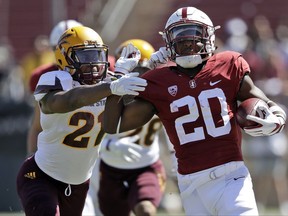 Stanford running back Bryce Love (20) runs for a touchdown past Arizona State defensive back Chad Adams (21) during the first half of an NCAA college football game Saturday, Sept. 30, 2017, in Stanford, Calif. (AP Photo/Marcio Jose Sanchez)