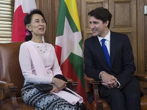 Aung San Suu Kyi, the civilian leader of Myanmar and an honourary Canadian citizen, shares a laugh with Canadian Prime Minister Justin Trudeau in his office on Parliament Hill in Ottawa, Wednesday June 7, 2017.