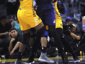 Los Angeles Sparks forward Nneka Ogwumike (30) tries to get the ball from Phoenix Mercury's Brittney Griner (42) during the first half of a WNBA basketball playoff game Tuesday, Sept. 12, 2017, in Los Angeles. (Stephen Carr/Los Angeles Daily News via AP)