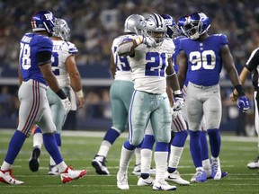 Dallas Cowboys running back Ezekiel Elliott (21) gestures "feed zeke" after a run for first a first down in the second half of an NFL football game a against the New York Giants on Sunday, Sept. 10, 2017, in Arlington, Texas. (AP Photo/Ron Jenkins)