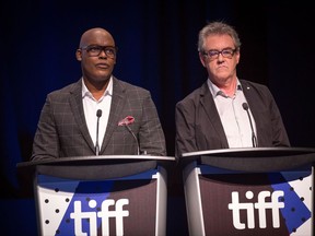 Artistic director of the Toronto International Film Festival Cameron Bailey, left, and director and CEO Piers Handling introduce the winners of the TIFF Awards in Toronto, Sunday, Sept.17, 2017. THE CANADIAN PRESS/Chris Donovan