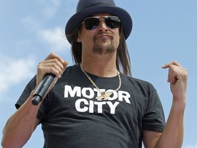 FILE - In this Feb. 22, 2015 file photo, Kid Rock performs before the Daytona 500 NASCAR Sprint Cup series auto race at Daytona International Speedway in Daytona Beach, Fla. A civil rights organization said Wednesday, Sept. 6, 2017, they are demanding the cancellation of concerts by Kid Rock at a new sports arena in Detroit, saying his criticism of NFL quarterback Colin Kaepernick was a "dog whistle" to white supremacist groups. (AP Photo/Terry Renna, File)